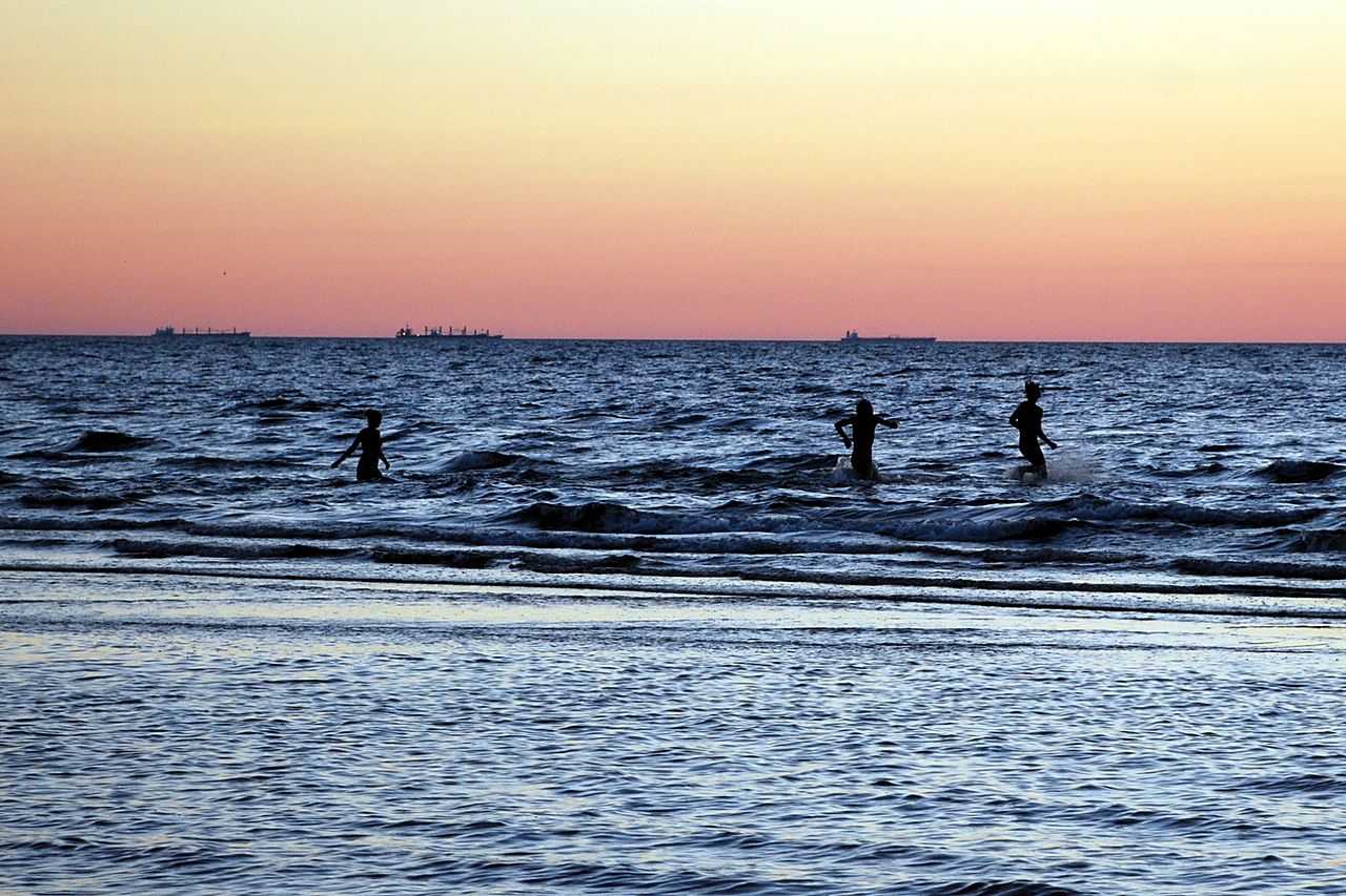 people running into the sea -- this is how I feel facing digital marketing overwhelm