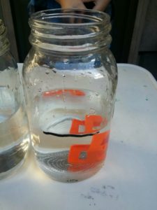 The plastic chair did not displace much water so we tried something else.