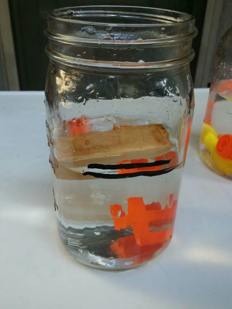 Why does wood float and plastic does not?