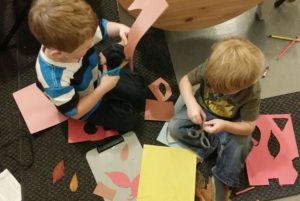 fall crafts with kids | tracing and cutting leaves from colored paper